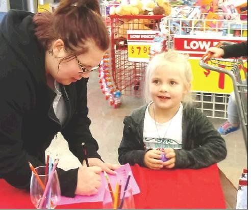 Frank Coleman | The Marlin Democrat          Maverick Dunham Lilly Siedelmann and Laura Siedelmann could not wait to get their letters out to Santa this year via letters prepared by and put out by HEB.