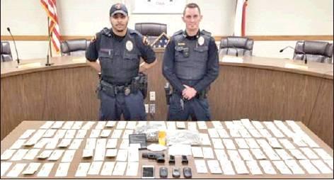 Drosto Montgomery | The Marlin Police Department<br />          Officer Callazo and Interim Police Chief Sodek standing proud in front evidence from a recent drug bust.