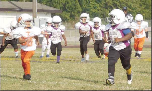 Raymond Moore | The Marlin<br />          Big Brent Murphy of the Marlin bantam peewee team rumbled his way into the end zone on a monster 68-yard rush.