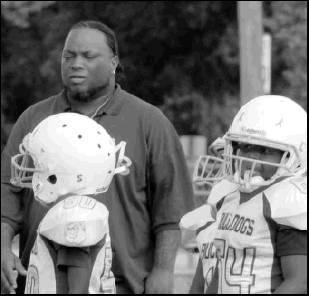 Coach Desmond Evans giving his team a little pep talk during the Franklin game last Saturday morning in Marlin.