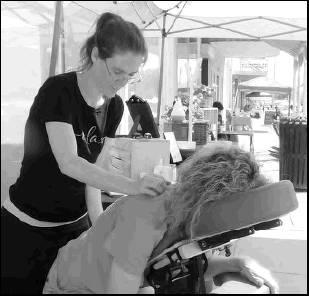 Sabrina Tarbutton was more than happy to offer free massages during the Market on Main Street last weekend.