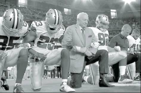 Jerry Jones, owner of the Dallas Cowboys along with Jason Garrett, Head Coach kneel prior to the National Anthem on Monday Night Football. The Cowboys stood and locked arms during the Flag presentation and the Anthem. According to reports, the decision to kneel was a “team decision.”