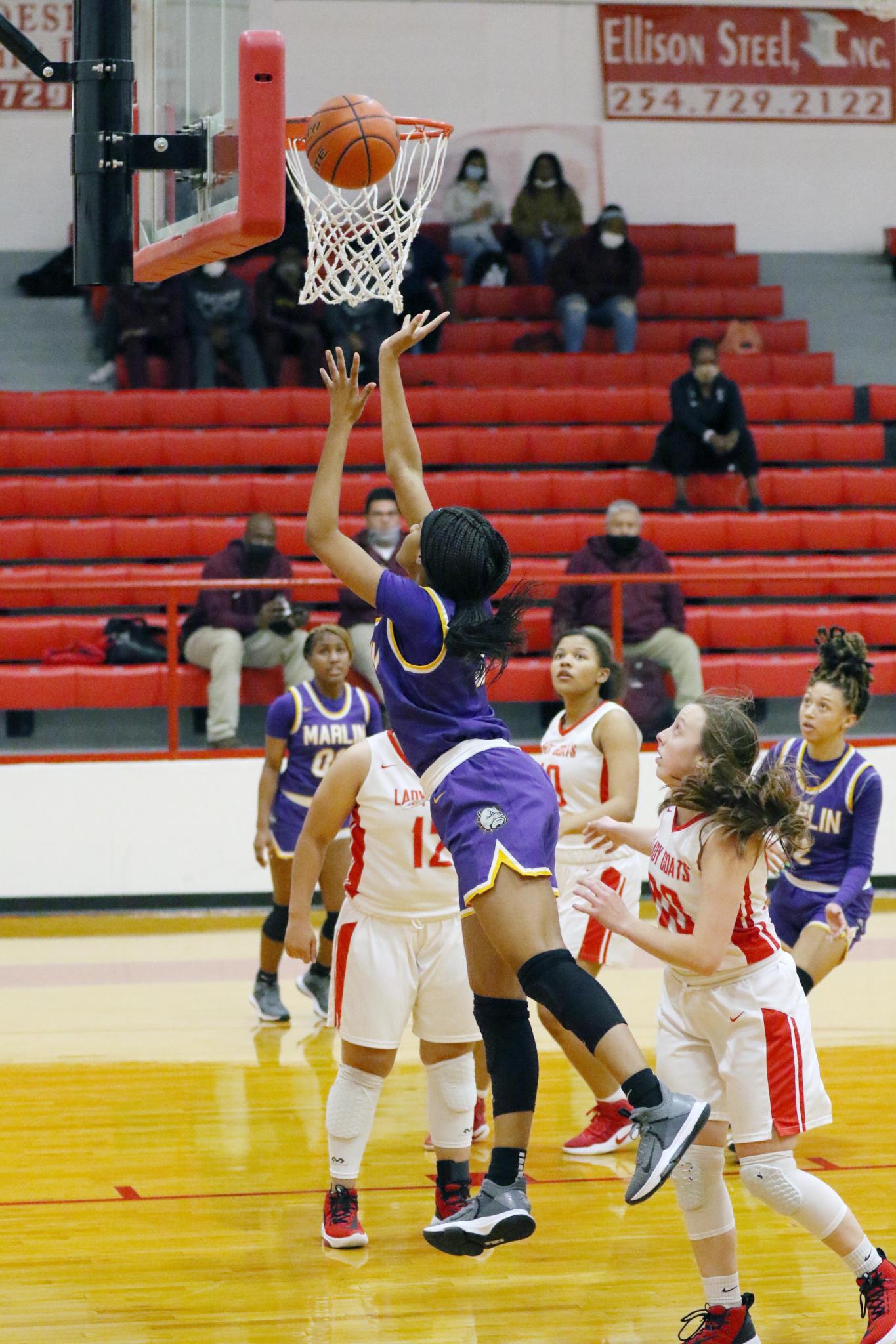 Marlin's Aniya Williams scores two of her 23 points against Groesbeck on Friday night. The Lady Bulldogs won their sixth consecutive game, 59-47.Photo by Angela Crane/For the Marlin Democrat