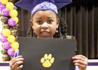 Azayla Landrum shows off her Kindergarten diploma. Photos Submitted by Antionette Bradley