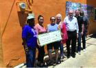 From Left to Right: Vice President, Hermetta Paul, Refresqueria Tropical Owner, Martha Coronado, Treasurer, Melissa Mahoney, Mayor Susan Byrd, President, Dr. John Barrett, Secretary, William P. Roe, Executive Director Winston G. Williams. Photo courtesy o
