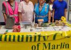 Photographs-R: At the Community Garden Club’s “Gardening for Health” table at the Chilton Family Health and Back-to-School Expo are Letitia Estep, Bettye Tarver, Myriam Virella, and Expo attendees Maribel Martinez, Leroy Peciba