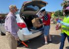 Volunteers from all around the Falls County community and the Central Texas Food Bank came together to distribute two full truckloads of food to those in need on April 24. For more photos, log on to marlindemocrat.com.