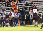 Marlin’s Ty Harris gains yardage against the Milano Eagles on Friday night. The Bulldogs got their first win of the season 21-0 on the road Friday night. Photo courtesy of Steve Young