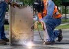 Photo: Railroad workers welding lags. Madison Mahoney