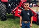 Maverick Cannon, age 9, son of Liz and Maverick Cannon awarded belt buckle: Junior Showmanship 2020 at the Falls County Junior Fair. California Rabbit, white  1st time time showing the rabbit. 